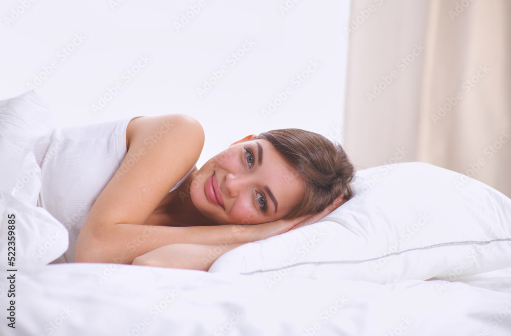Beautiful girl sleeps in the bedroom, lying on bed Beautiful girl sleeps in the bedroom, lying on bed