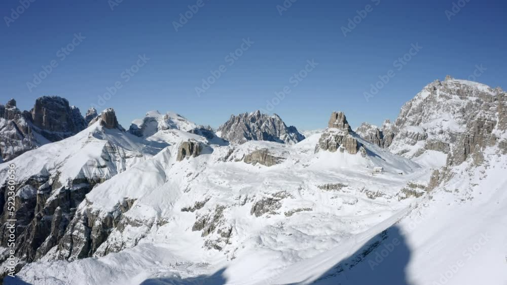 Aerial Forward Shot Of Snow Covered Log Cabin On Mountain Against Clear Sky - Tre Cime di Lavaredo, Italy Aerial Forward Shot Of Snow Covered Log Cabin On Mountain Against Clear Sky - Tre Cime di Lavaredo, Italy