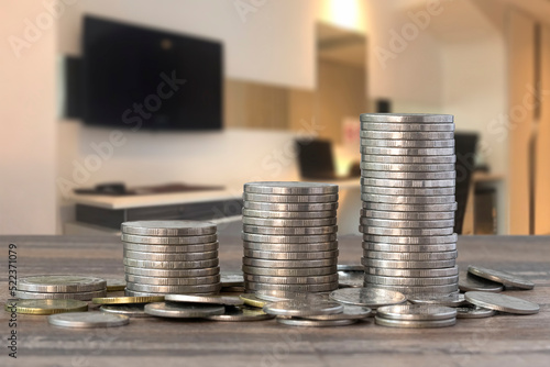 Money-saving idea with coins stacked in a bar graph.