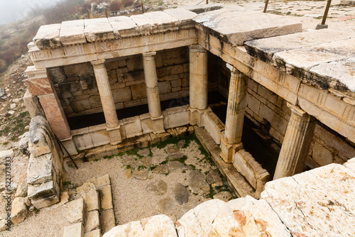 Принти на полотні Partially restored Hellenistic fountain house in Doric style at archaeological s