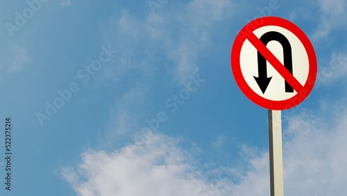 Illustration of a "Do not U-turn" traffic sign and a sky background.