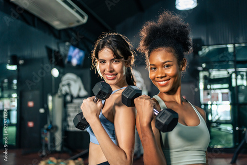Portrait of African american and Latino sportswoman exercise in gym. 