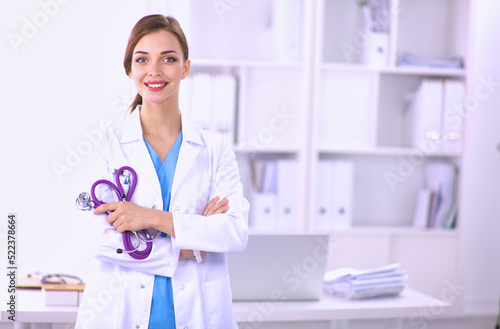 Medical team sitting at the table in modern hospital