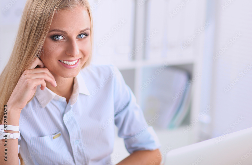 Portrait of beautiful young business woman working on a laptop Portrait of beautiful young business woman working on a laptop