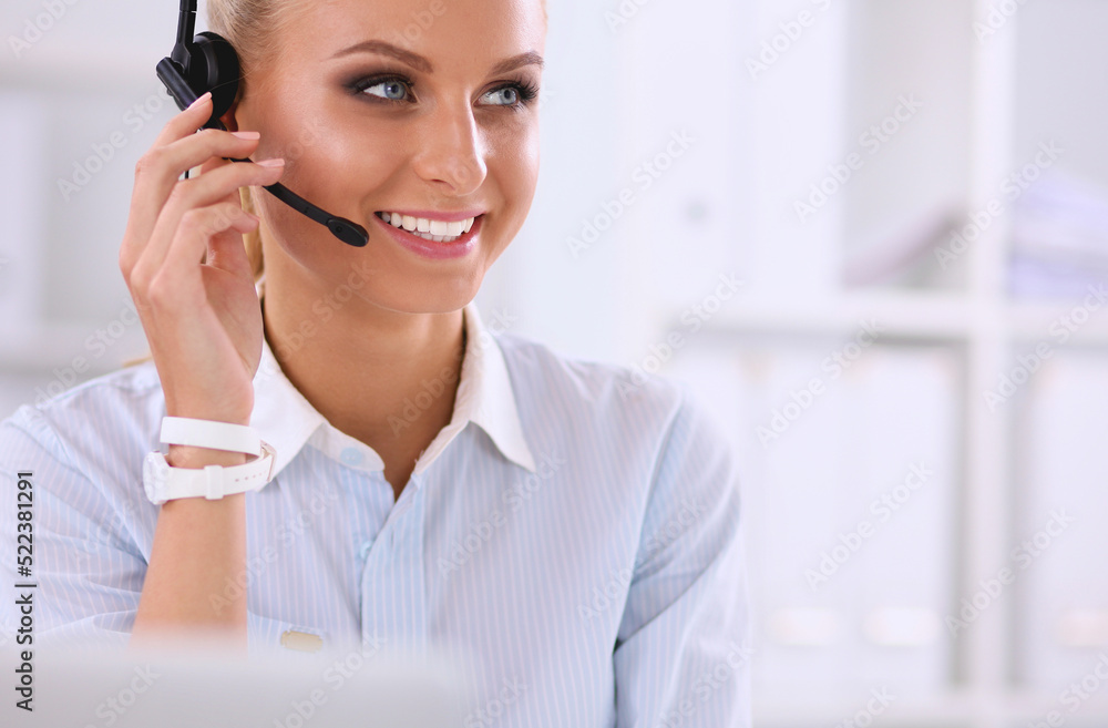 portrait of a customer service agent sitting at office portrait of a customer service agent sitting at office