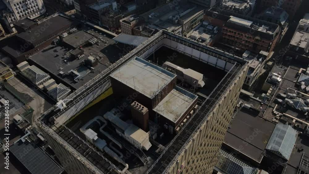4K 60 FPS Birdseye Aerial drone flight over Manchester Arndale Tower with retail buildings rooftops below 4K 60 FPS Birdseye Aerial drone flight over Manchester Arndale Tower with retail buildings rooftops below