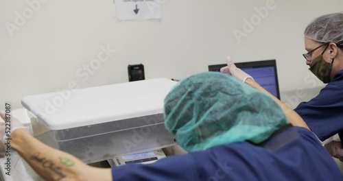 person weighing a container of cannabis 