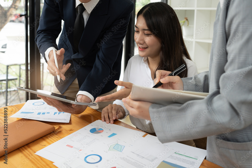 Administration or Accountant discussing with partner are meeting to audit finance planning sales to meet targets set in next year. Finance concept