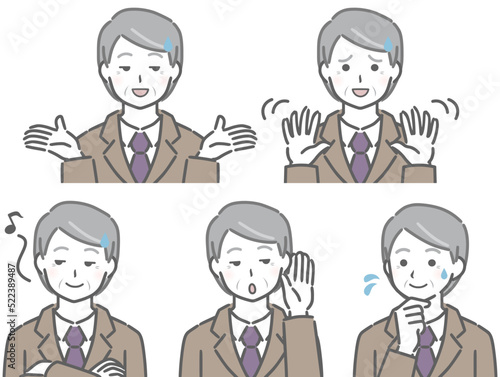 とぼけるスーツの高齢男性