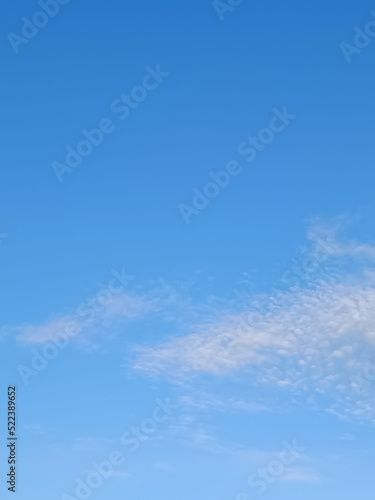 vertical figure blue sky and clouds and copy space