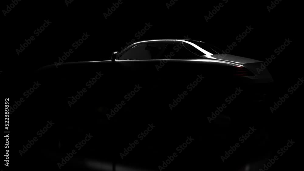 The silhouette of the car slowly emerges from the darkness. The silhouette of the car slowly emerges from the darkness.