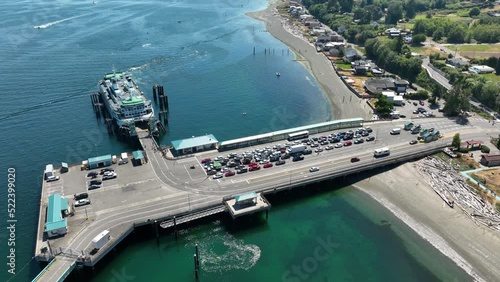 Aerial shot of cars exiting a docked ferry on Whidbey Island. photo