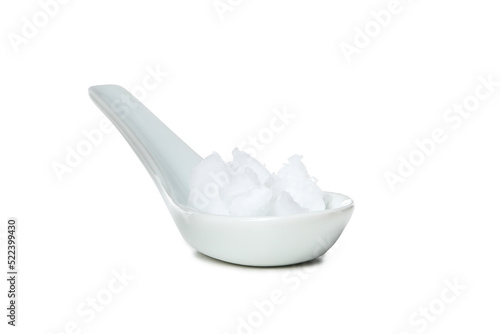 Porcelain spoon with Shea butter isolated on white background