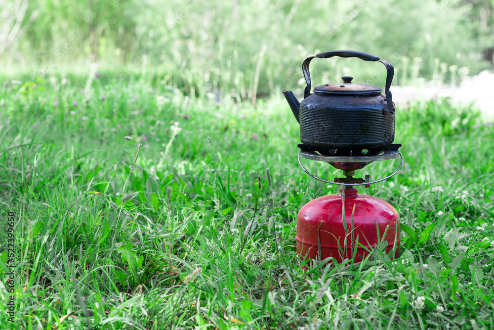 smoked kettle on a gas burner on the grass smoked kettle on a gas burner on the grass