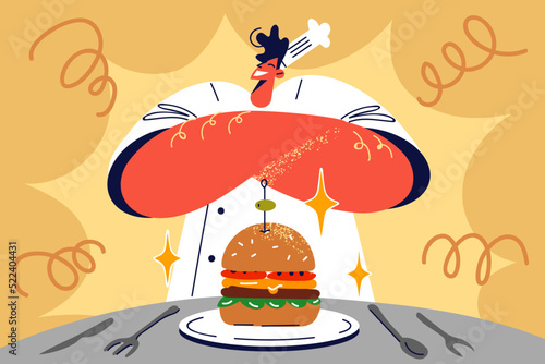 Proud male chef presenting burger 