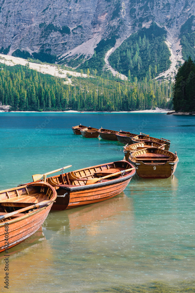 Boats in the rain on the beautiful Lago di Braies, Italy