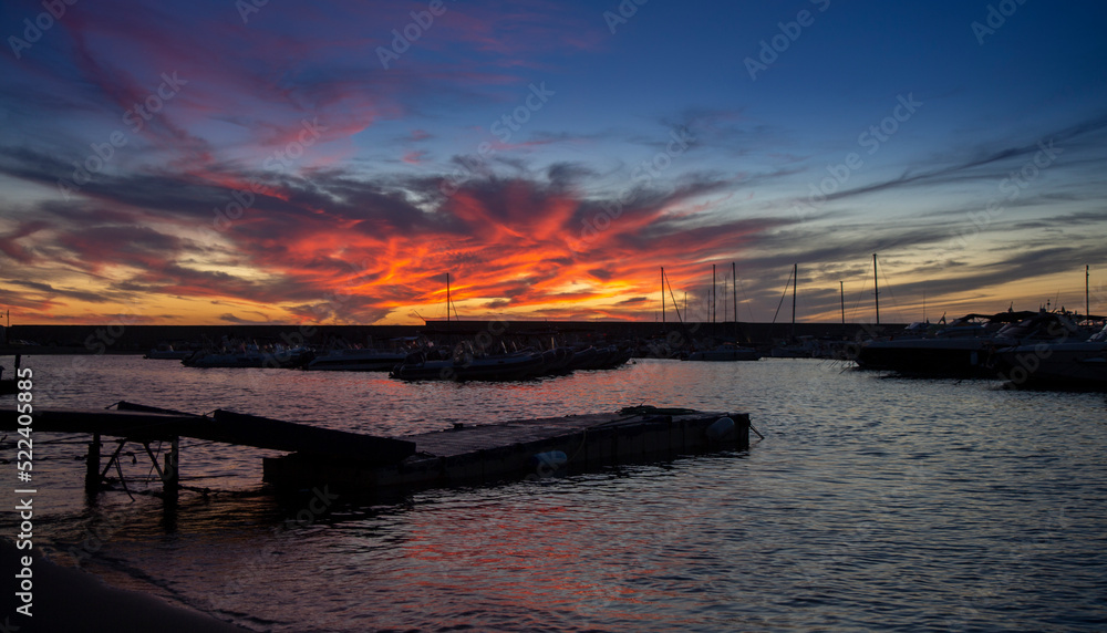 Obraz premium ischia forio italy harbour modern boat at sunset