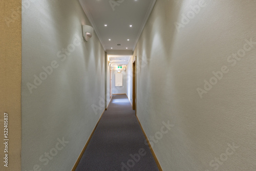 Interior of a hotel corridor with doors