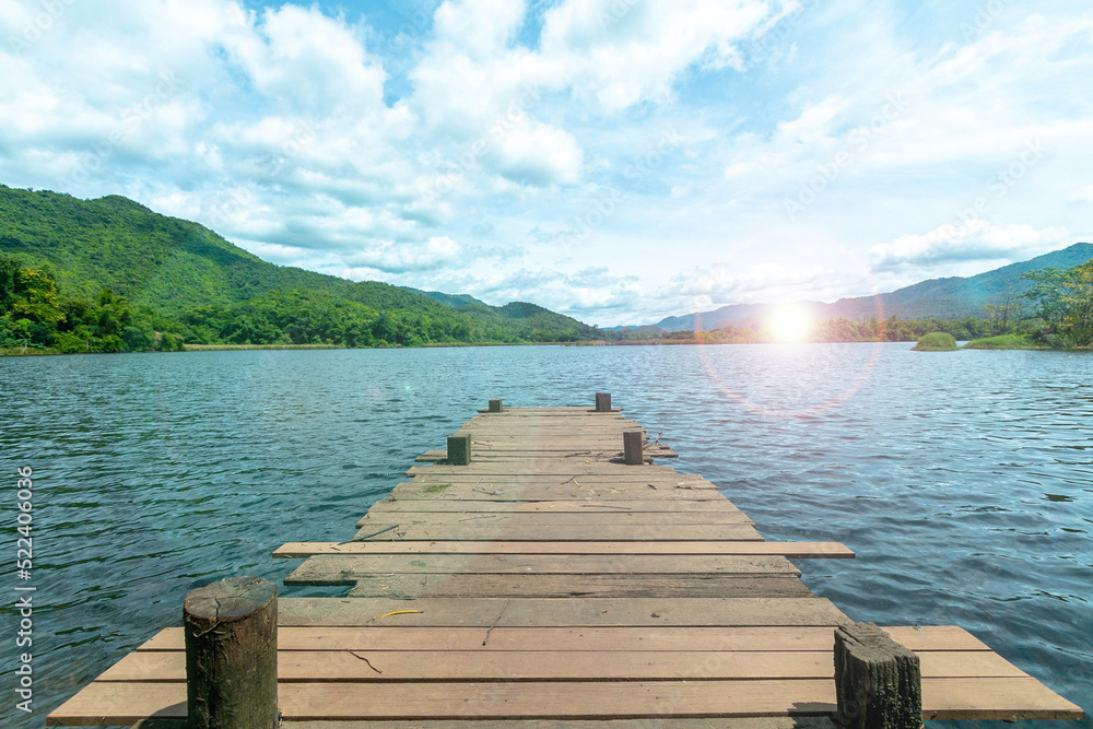  Wooden bridge  with the lake mountain and sky landscape. Wood floor with lake mountain and sky of nature park background and summer season