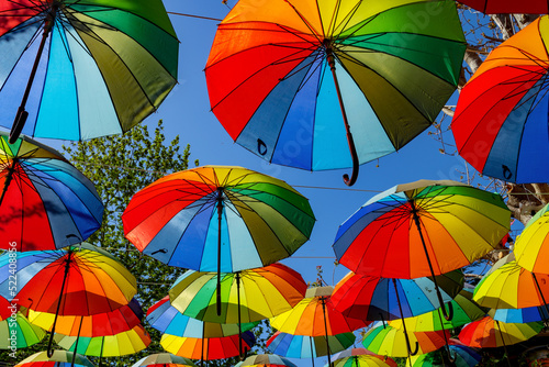 Colorful rainbow umbrella street decoration for background