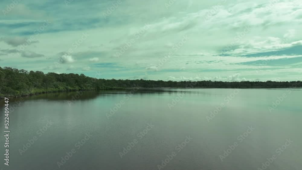 Gliding low over the moody waters of Lake Cootharaba - droning paradise Gliding low over the moody waters of Lake Cootharaba - droning paradise