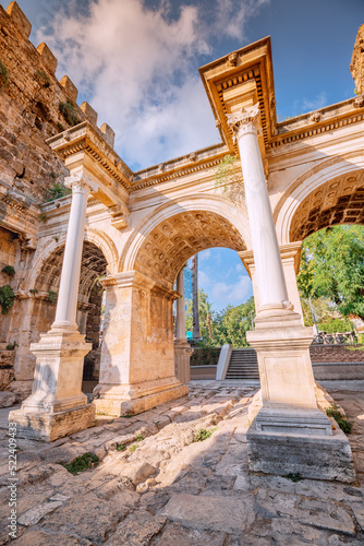 Vertical dramatic view of famous gate or Hadrianus arch in Antalya without visitors. Travel landmarks and must-see tourist and sightseeing sites in Turkey