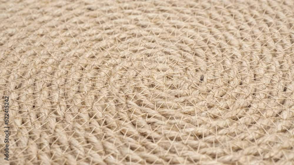 Jute braided spiral rug texture background clos-up. Jute braided spiral rug texture background clos-up.