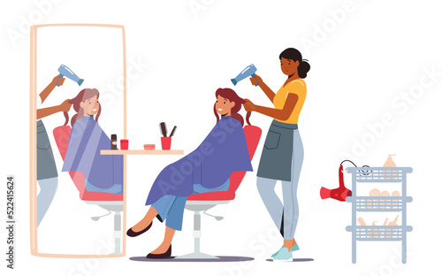 Young Woman Visiting Beauty Salon. Hairdresser Master doing Haircut for Girl Drying Hair with Fan in front of the Mirror
