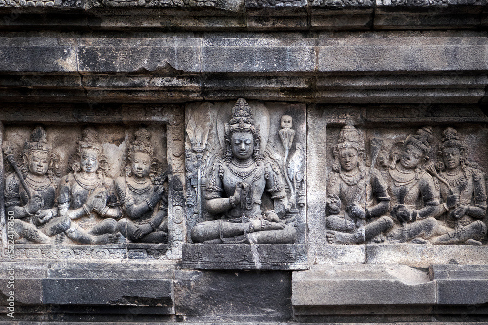 Carving Relief In Prambanan Temple. The temple is adorned with panels of narrative bas-reliefs telling the story of the Hindu epic Ramayana and Bhagavata Purana.