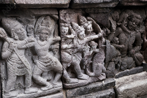 Carving Relief In Prambanan Temple. The temple is adorned with panels of narrative bas-reliefs telling the story of the Hindu epic Ramayana and Bhagavata Purana. photo