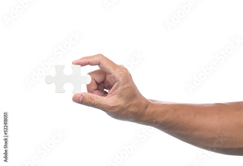 Hand with jigsaw puzzle isolated