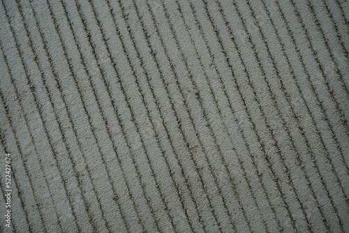 reinforced concrete road surface (scratches make the skin rough)