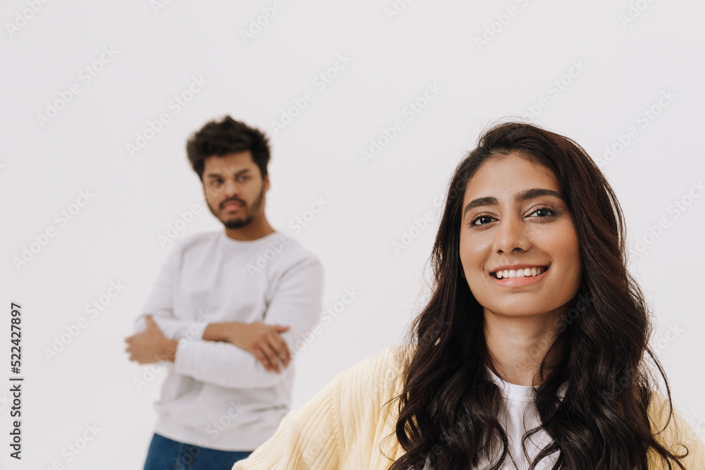 Young indian couple looking at camera while posing together Young indian couple looking at camera while posing together