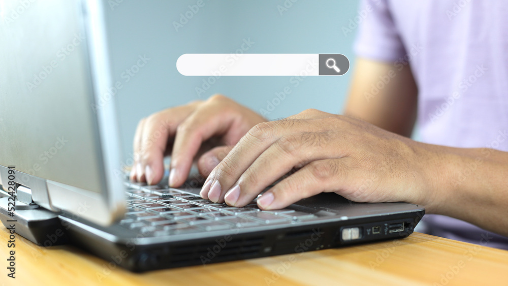 Data search technology search engine optimization with blank search bar, man hands working with laptop computer Searching internet data information. Data search technology search engine optimization with blank search bar, man hands working with laptop computer Searching internet data information.