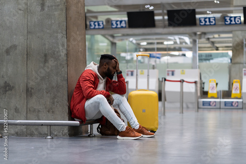 Ταπετσαρία Sad African American man upset at airport his flight is delayed