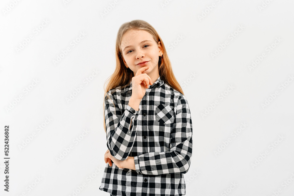 Thoughtful young girl with blonde hair touch chin with finger thinking or considering, making decision imagining idea, posing isolated on white studio background Thoughtful young girl with blonde hair touch chin with finger thinking or considering, making decision imagining idea, posing isolated on white studio background