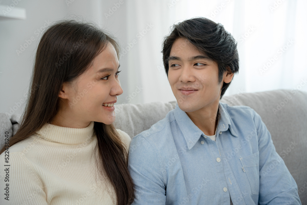 Asian couple smiling and happily looking into each other's eyes, cuddling, warm hugs, teenager's first love, married couple, warm family. Husband and wife are happy with new home. Asian couple smiling and happily looking into each other's eyes, cuddling, warm hugs, teenager's first love, married couple, warm family. Husband and wife are happy with new home.