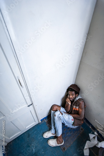Substance Abuse, lost in a corner. A vulnerable moment. Series of images of drug users and their consequences. photo