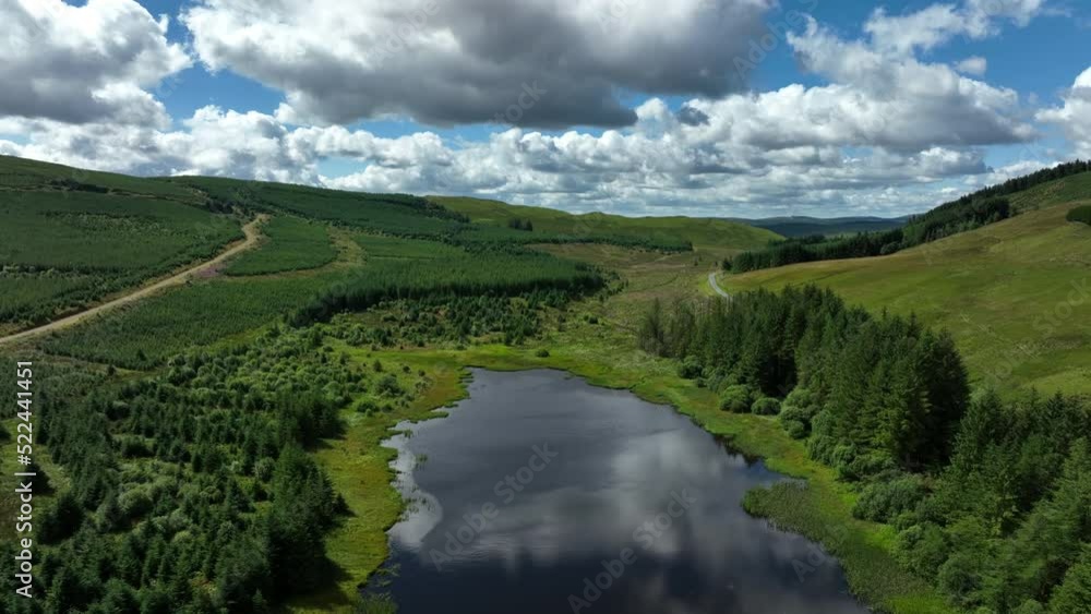 aerial view of the scottish borders countryside near moffat on a blue sky day with clouds during a day in the summer aerial view of the scottish borders countryside near moffat on a blue sky day with clouds during a day in the summer
