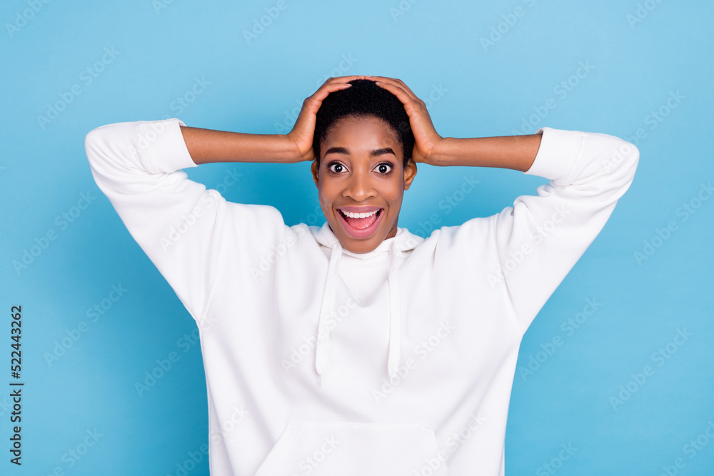 Photo of youth cheerful man woman excited reaction news hands touch head isolated over blue color background Photo of youth cheerful man woman excited reaction news hands touch head isolated over blue color background