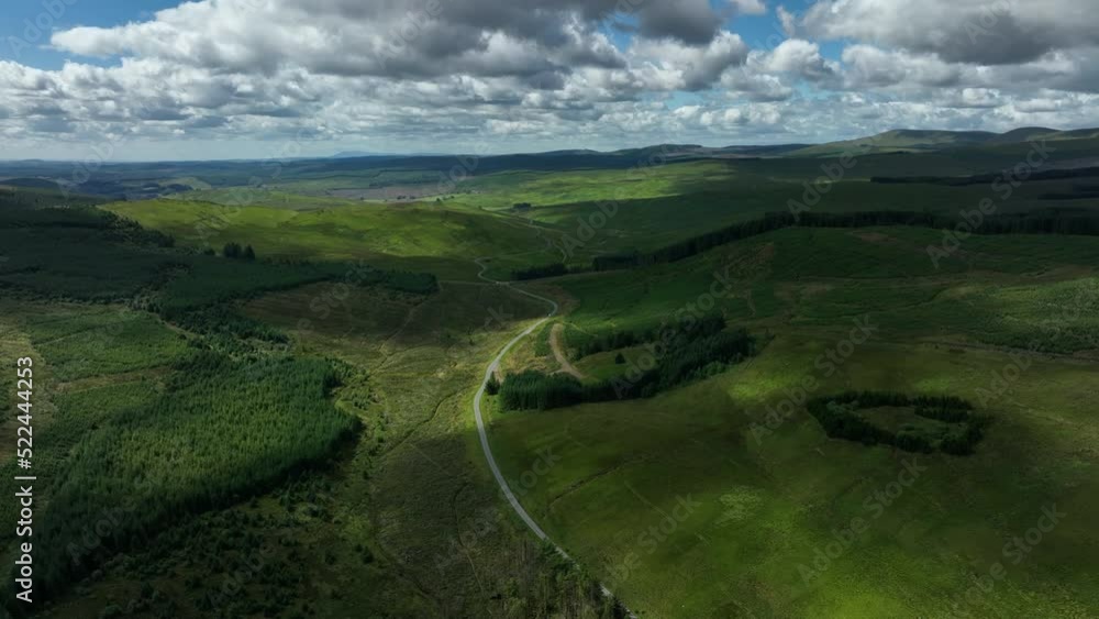 aerial view of the scottish borders countryside near moffat on a blue sky day with clouds during a day in the summer aerial view of the scottish borders countryside near moffat on a blue sky day with clouds during a day in the summer