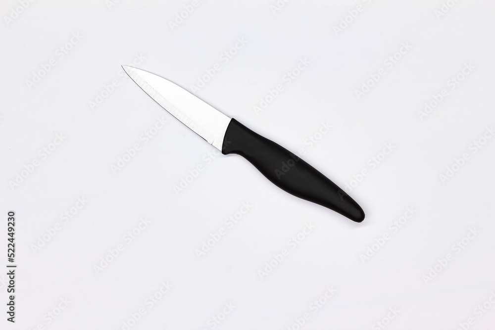 Kitchen knife for vegetables on white background. Chef Butchers knife for peeling and cutting vegetables and fruits. Kitchenware. Professional food preparation. Close-up. Top view. Isolated Kitchen knife for vegetables on white background. Chef Butchers knife for peeling and cutting vegetables and fruits. Kitchenware. Professional food preparation. Close-up. Top view. Isolated