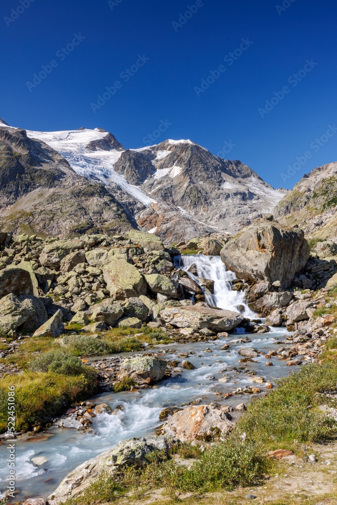 mountain creek in front of Steingletscher on Sustenpass in the Bernese Alps