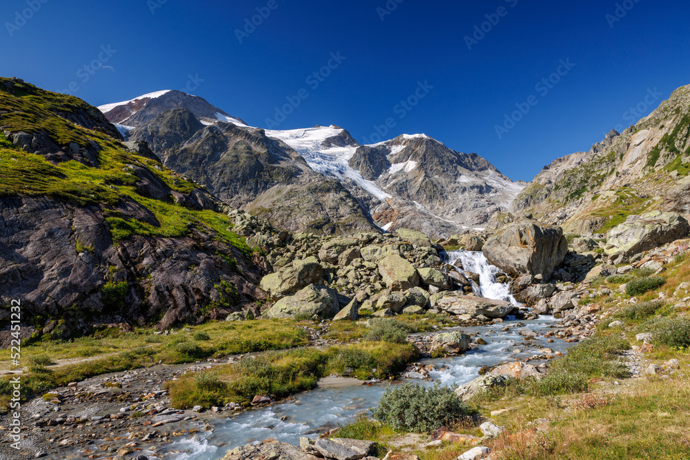 mountain creek in front of Steingletscher on Sustenpass in the Bernese Alps mountain creek in front of Steingletscher on Sustenpass in the Bernese Alps