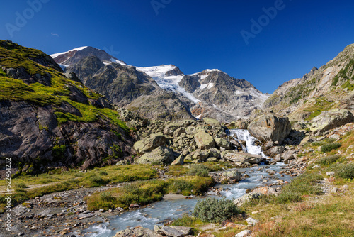 mountain creek in front of Steingletscher on Sustenpass in the Bernese Alps © schame87