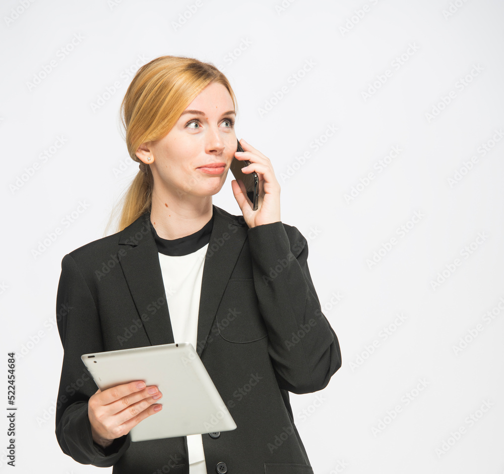 young woman in business clothes is using a tablet isolated young woman in business clothes is using a tablet isolated