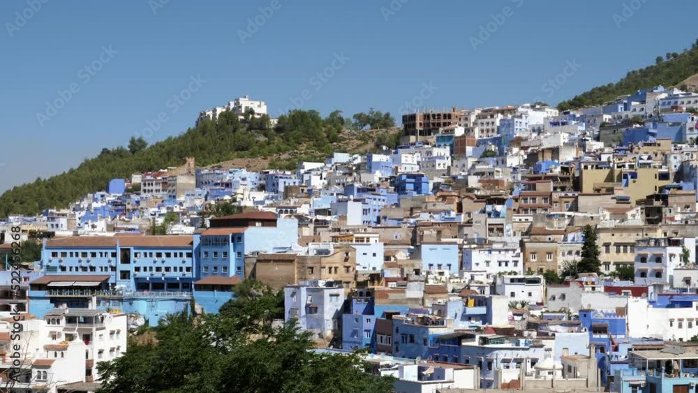 View of the Medina of Chefchaouen, Morocco. Famous touristic travel destination because of its blue painted houses. 4k, establishing shot. View of the Medina of Chefchaouen, Morocco. Famous touristic travel destination because of its blue painted houses. 4k, establishing shot.