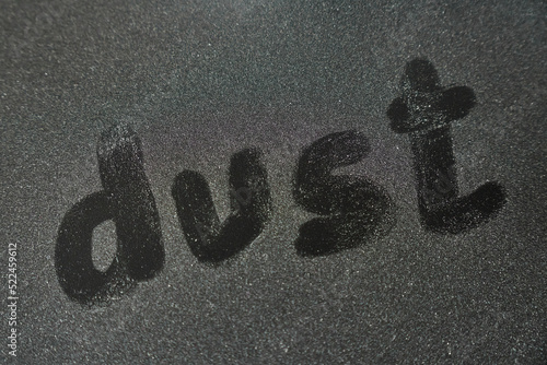 Dust, on dusty black surface