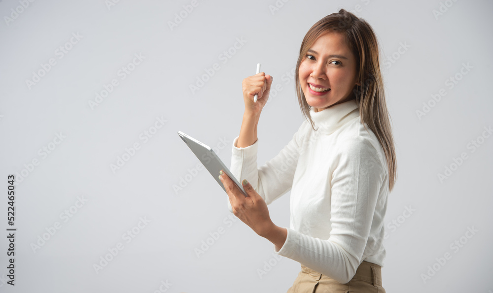 Business, people, gestures and technology concepts - smiling or success businesswoman with tablet showing thumbs up over gray background. Business, people, gestures and technology concepts - smiling or success businesswoman with tablet showing thumbs up over gray background.
