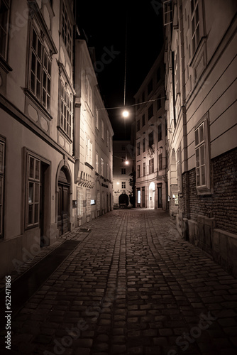 Narrow Alley With Streetlights And Cobblestones In The Inner City Of Vienna In Austria